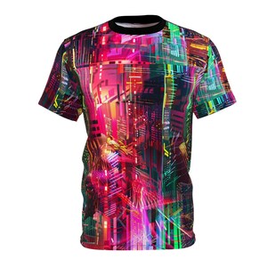 May include: A short-sleeved t-shirt with a colorful, abstract design featuring geometric shapes and lines in shades of pink, red, green, yellow, and blue.