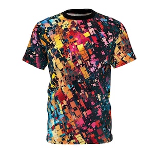 May include: A black t-shirt with a colorful abstract print featuring geometric shapes and lines in shades of red, orange, yellow, blue, and pink.