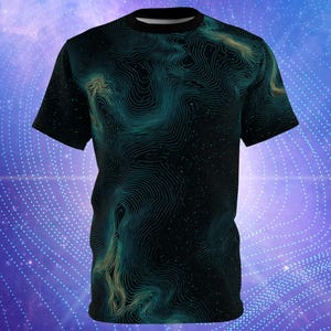 May include: Black t-shirt with a swirling, topographic-like pattern in shades of teal and gold. The design covers the entire shirt, creating a unique visual effect. The shirt has a classic crew neck and short sleeves.