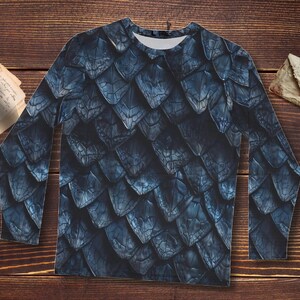 May include: A long-sleeved shirt with a blue and gray dragon scale pattern.