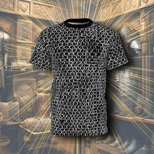 May include: A black t-shirt with a white chainmail pattern. The shirt is photographed in front of a display of medieval armor.