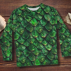 May include: Green long-sleeved shirt with a dragon scale pattern.