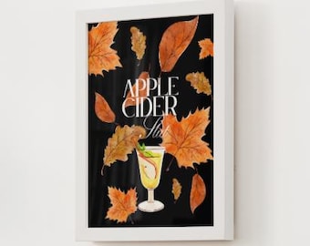 Può includere: Una stampa incorniciata con un'illustrazione ad acquerello di un cocktail di sidro di mele. L'immagine ha uno sfondo nero con foglie autunnali arancioni sparse intorno al bicchiere. Le parole "Apple Cider Slush" sono scritte in bianco.