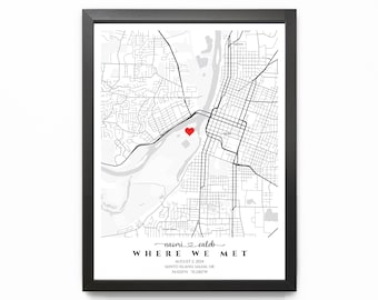 May include: A black and white map of a city with a red heart marking a location. The text "naori & caleb WHERE WE MET" is below the map. The date "AUGUST 2, 2024" and the location "MINTO ISLAND, SALEM, OR 44.0297N, 123.2182W" are also included.