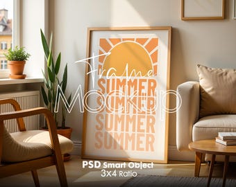 May include: A framed poster with a summer theme. The poster features a yellow sun with orange rays and the word "SUMMER" repeated five times in a stacked format. The poster is hanging on a white wall in a living room setting.
