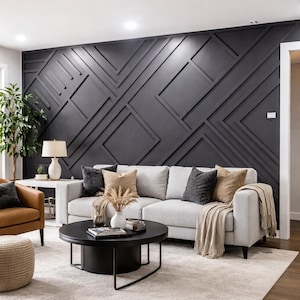May include: A modern living room featuring a gray sofa, a black coffee table, and a patterned dark gray accent wall. The room includes a beige rug, a brown leather armchair, and decorative pillows. A floor plant and a table lamp add to the decor.