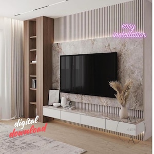 May include: A modern living room with a large flat screen TV mounted on a wall with a marble and wood panel design. The TV is on a white floating shelf with drawers. There is a tall wooden shelf with books and decor on the left side of the TV. The text "easy installation" is in pink neon letters above the TV.