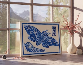 May include: A framed print featuring a blue moth and caterpillar design on a cream background. The print includes Japanese text and is displayed on a windowsill with a mountain view. Decorative vase with red berries.