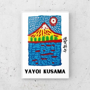 May include: A framed art print featuring a colorful illustration of a mountain with a red peak, yellow and green trees, and blue water. The print includes the text "YAYOI KUSAMA" in black at the bottom.