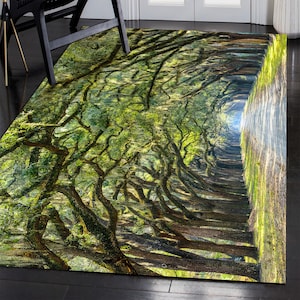 May include: Rectangular area rug featuring a vibrant, detailed image of a tree-lined pathway. The rug showcases a perspective view with lush green foliage and sunlight filtering through the branches, creating a natural, inviting scene.