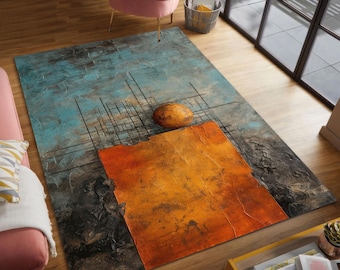 May include: Abstract art rug with a textured design. The rug features a blue background with orange and black geometric shapes and a brown oval. The rug is rectangular and placed on a wooden floor.