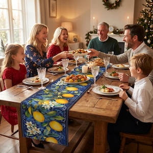 May include: A rectangular table runner featuring a vibrant pattern of yellow lemons, green leaves, and white blossoms set against a deep blue background, displayed on a wooden dining table with place settings and a family gathering.