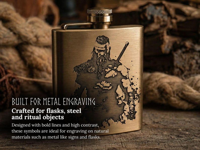 May include: A rectangular, brass-colored flask with a detailed engraved image of a Viking warrior holding a sword. The flask has a screw-on cap and a hinged top. Text on the image reads "BUILT FOR METAL ENGRAVING" and "Crafted for flasks, steel and ritual objects."