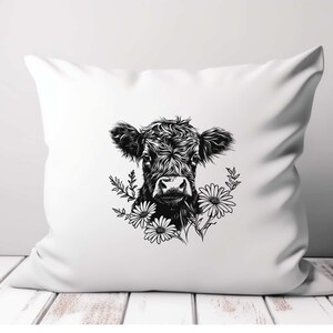 May include: Black and white illustration of a cow's head with flowers around it. The cow has a fluffy, curly coat and is looking directly at the viewer. The flowers are simple daisies.