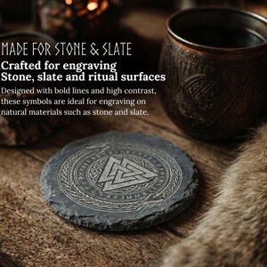May include: A round, dark gray slate coaster with an engraved geometric design and text. The coaster is on a wooden surface, next to a copper mug and a small bowl. The text reads "MADE FOR STONE & SLATE".