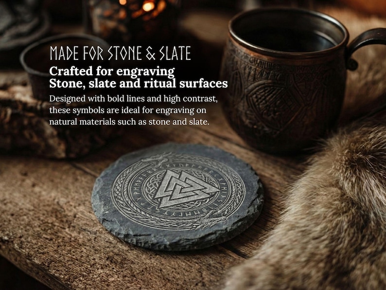 May include: A round, dark gray slate coaster with an engraved geometric design and text. The coaster is on a wooden surface, next to a copper mug and a small bowl. The text reads "MADE FOR STONE & SLATE".