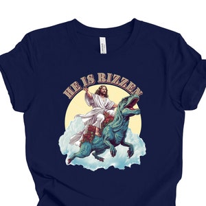 He Is Rizzen T-shirt | Jesus Riding A Dinosaur T-shirt | Funny Trex Shirt | Funny Christian Shirt | Funny Meme Shirt | Funny Jesus Shirt