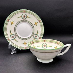 Teacup and saucer. Bone China. “Daventry” pattern by Minton. Delicately done artwork and Minton quality is a treasure. Gorgeous antique set