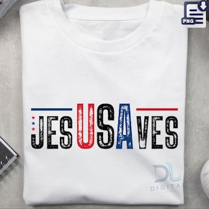 May include: White t-shirt with the text "JESUS USA VES" in a bold, distressed font. The letters are black, with red and blue accents. The design includes stars and stripes, evoking a patriotic theme.