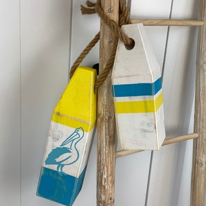 Wood painted lobster buoys / pelican / blue and yellow / coastal decor / nautical / beach decor / Island Decor