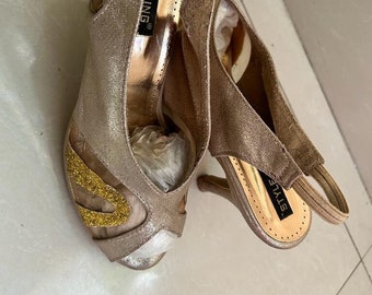 Golden peep toes