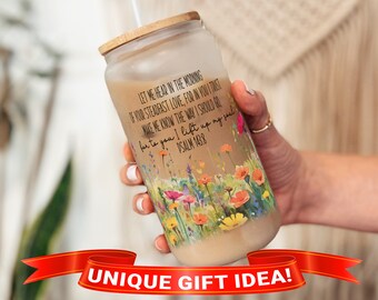 May include: A clear glass tumbler with a bamboo lid and a straw. The tumbler has a floral design and a quote from Psalm 143:8, "Let me hear in the morning of your steadfast love, for in you I trust. Make me know the way I should go, for to you I lift up my soul."
