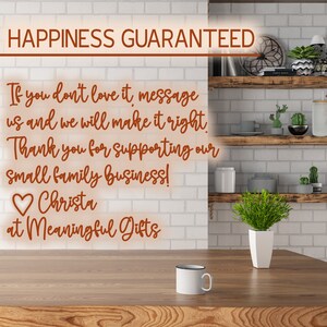 May include: A white brick wall with a handwritten message in brown text that reads "Happiness Guaranteed. If you don't love it, message us and we will make it right. Thank you for supporting our small family business! Christa at Meaningful Gifts."