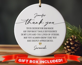 May include: White ceramic ornament with black text that reads "Jennifer thank you Your dedication has made an unforgettable difference in my life and the lives of others. May you always know that you are deeply appreciated. Savannah".