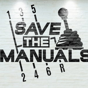May include: A white brick wall with black lettering that reads "SAVE THE MANUALS" with a black gear shift lever graphic above the text. The gear shift lever has numbers 1, 2, 3, 4, 5, 6, and R around it.