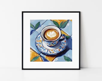 May include: A close-up of a cup of coffee with a heart-shaped design in the foam. The cup is white with blue and orange floral designs and is sitting on a blue and orange patterned saucer. The cup and saucer are on a blue and yellow tiled surface.