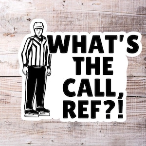 May include: Black and white illustration of a hockey referee with the text "What's the call, ref?"