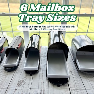 May include: Six black mailboxes with open trays are displayed on a wooden surface. The text "6 Mailbox Tray Sizes" is at the top, with additional text below. The mailboxes are in front of a window.