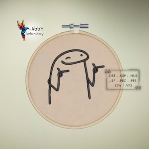 May include: A beige embroidery hoop with a black line drawing of a stick figure with a winking face and pointing fingers. The text "Abby Embroidery" is in the upper left corner of the image. The text ".DST .EXP .HUS .JEF .PEC .PES .SEW .VP3" is in the lower right corner of the image.