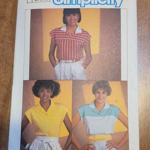 May include: Simplicity sewing pattern number 6755 for a collared shirt with short sleeves. The pattern includes three different styles: a striped shirt, a solid yellow shirt, and a two-toned shirt with blue and white stripes. The pattern is for sizes 10-12-14 and 38-40-42.