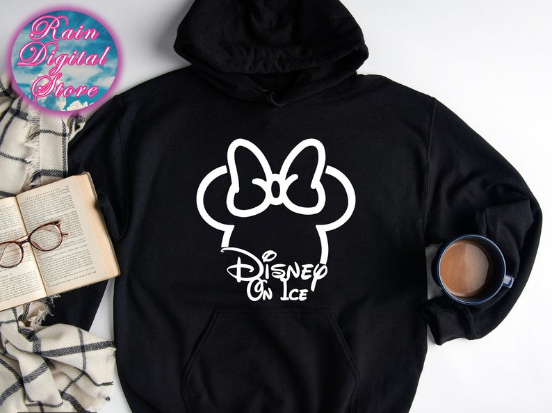 May include: Black hooded sweatshirt with a white outline of Mickey Mouse's head with a bow and the text "Disney On Ice".