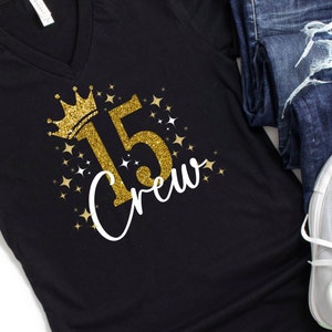 May include: Black t-shirt with gold glitter lettering that says "15 Crew" with a gold glitter crown above the number 15.