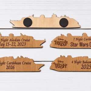 May include: Five laser-cut wooden cruise ship magnets. Four magnets feature engraved text including Disney Wonder, Fantasy, Treasure, and Wish, along with specific cruise details and dates. The top magnet shows the reverse side with two black circular magnets.
