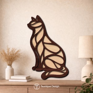 May include: A wooden cat silhouette wall art piece. The cat is depicted in a sitting position with a dark brown frame and a light wood interior. The design features a cutout pattern. The brand name "Teunique Design" is visible.