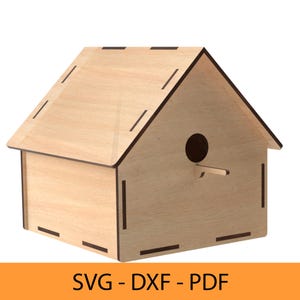 May include: A wooden birdhouse with a simple design, featuring a small entrance hole and a flat roof. The birdhouse is made of light brown wood and has a natural finish.