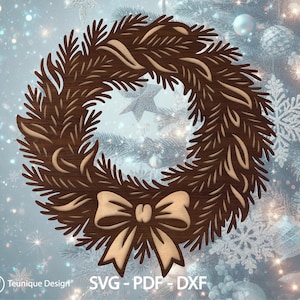 May include: A wooden Christmas wreath with a bow. The wreath is brown with a lighter brown bow at the bottom. The wreath is made of cut-out shapes of pine needles and leaves. The background is a blurred image of a Christmas tree.