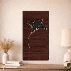 May include: A wooden wall art piece featuring a stylized black manta ray design with gold accents. The artwork is mounted on a rectangular, dark brown wooden panel. The design is minimalist and modern, suitable for coastal or nautical decor.