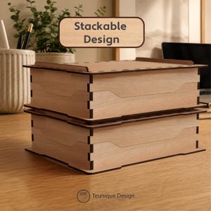 May include: Two stackable wooden boxes in a light brown finish with dark brown edges. The boxes have a unique design and the text "Stackable Design" is displayed above them. The Teunique Design logo is at the bottom.