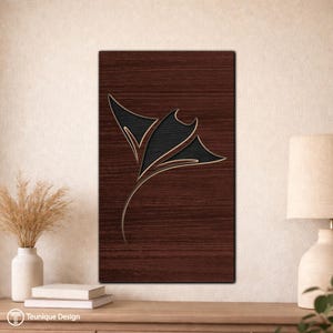 May include: A rectangular wooden wall art piece with a dark brown wood grain background. A black and gold stylized manta ray design is centered on the wood. The artwork is displayed on a light-colored wall.