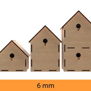 May include: Three wooden birdhouses of different sizes, each with a small round opening for birds to enter. The birdhouses are made of light brown wood and have a simple, rustic design. The smallest birdhouse is on the left, the middle birdhouse is in the center, and the largest birdhouse is on the right. The birdhouses are all 6 mm thick.