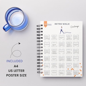 May include: A white spiral bound notebook with a black and white illustration of a person walking. The notebook has the text "30 Days Retro Walk Challenge" on the cover.