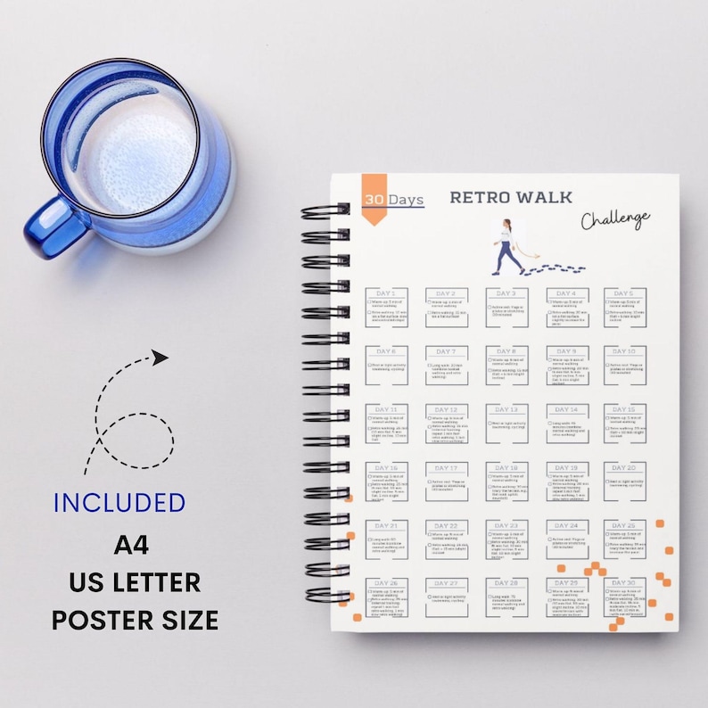 May include: A white spiral bound notebook with a black and white illustration of a person walking. The notebook has the text "30 Days Retro Walk Challenge" on the cover.