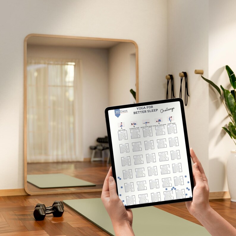 May include: A tablet displaying a 30-day yoga for better sleep challenge chart with daily poses and instructions. The screen shows a grid of boxes labeled day 1 through day 30, with small illustrations of yoga poses at the top and the title text.