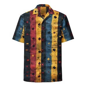 May include: Short-sleeved button-up shirt with a colorful abstract design. The shirt features vertical stripes in black, red, yellow, and blue, with geometric shapes. The shirt has a classic collar and is made of a lightweight fabric.