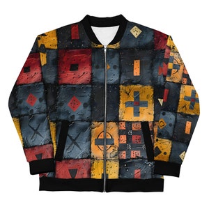 Puede incluir: Una chaqueta bomber negra con un estampado geométrico colorido. El estampado presenta cuadrados de rojo, amarillo, azul y negro con varias formas geométricas.
