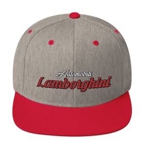 May include: A gray and red baseball cap with the text "Automobili Lamborghini" embroidered in red on the front.